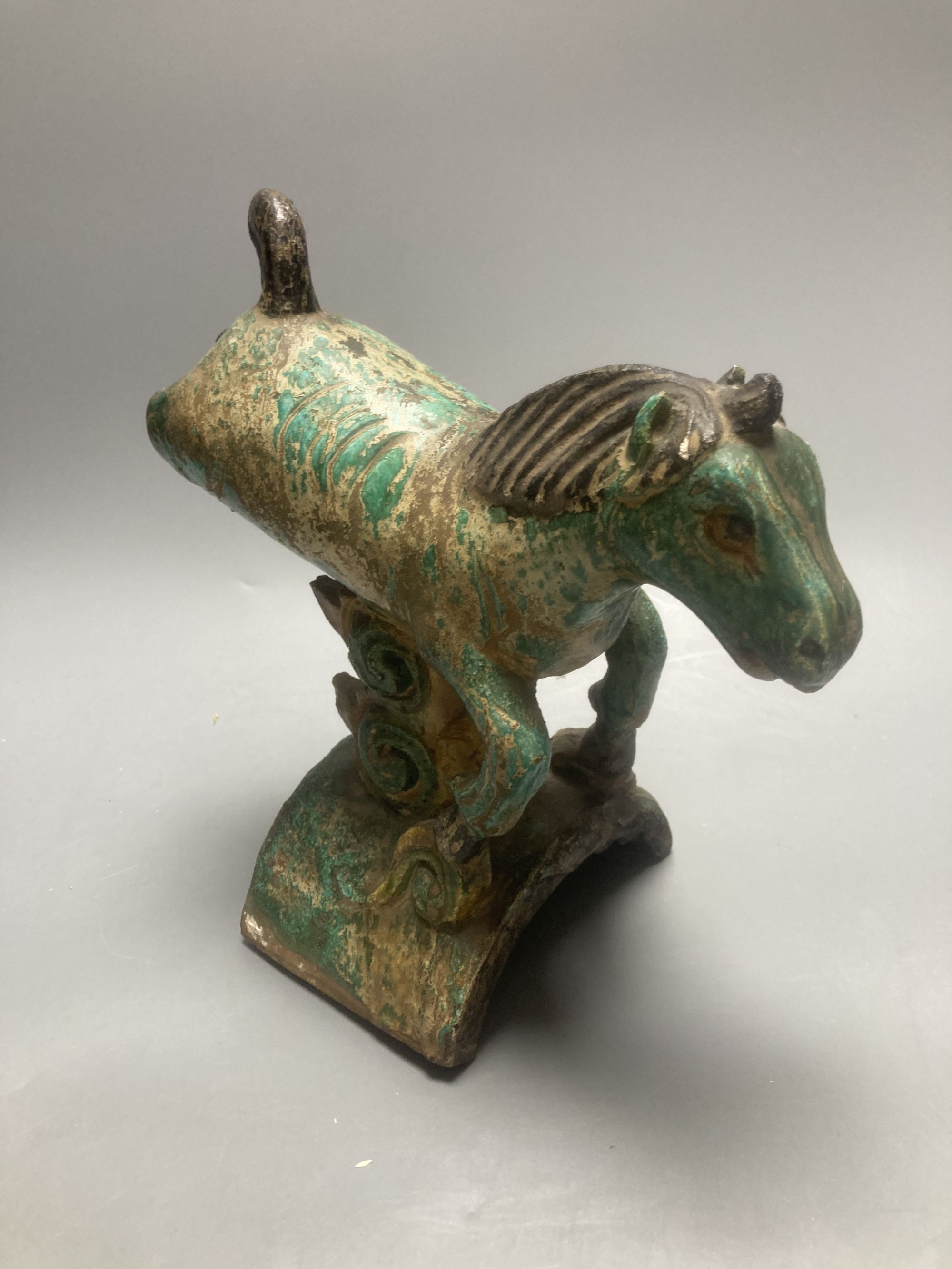 A Chinese Ming 'horse' ridge tile, height 24cm